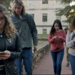 College students Hows the extreme addiction to smartphone via campus students scrolling while walking, not looking up